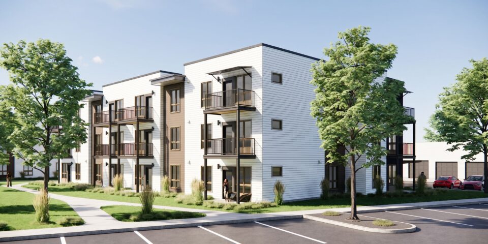 Modern three-story Bob Apartments building with balconies, trees, and parking lot under a clear blue sky