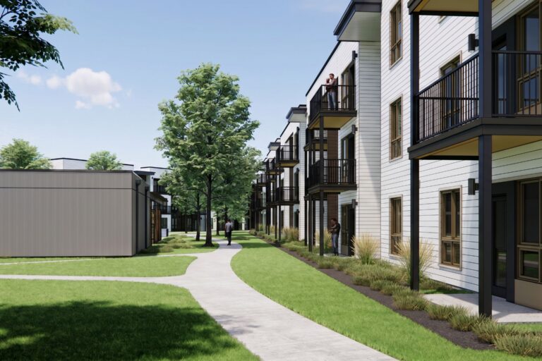 Landscaped courtyard between modern apartment buildings with balconies and a winding walkway