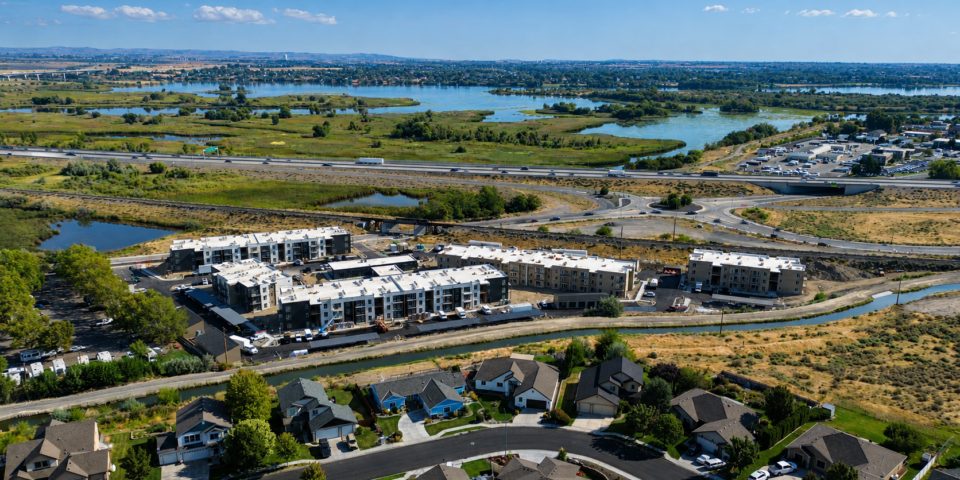 Aerial view of the Bob Apartments in Richland, Washington, beside wetlands, highways, and the Columbia River